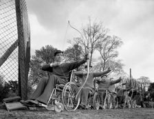 Archery practice at the CISWO paraplegic centre, Pontefract, West Yorkshire, 1960. Creator: Michael Walters