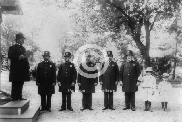 Archie and Quentin Roosevelt with White House policemen, c1902 June 17. Creator: Frances Benjamin Johnston.