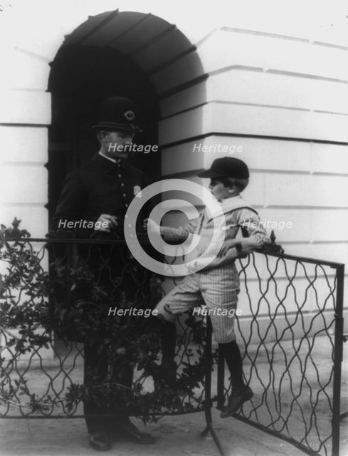 Archie Roosevelt and his friend the policeman, c1902. Creator: Frances Benjamin Johnston.