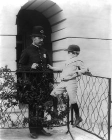 Archie Roosevelt and his friend the policeman, c1902 June 17. Creator: Frances Benjamin Johnston
