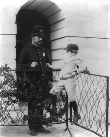 Archie Roosevelt and his friend the policeman, c1902 June 17. Creator: Frances Benjamin Johnston