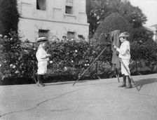 Archie Roosevelt photographing Quentin Roosevelt outdoors, 1902. Creator: Frances Benjamin Johnston