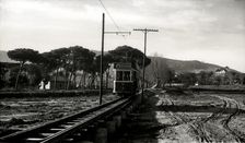 Argentona Mataró Tram crossing the pontoon on the river of Argentona, on a postcard of the 1920