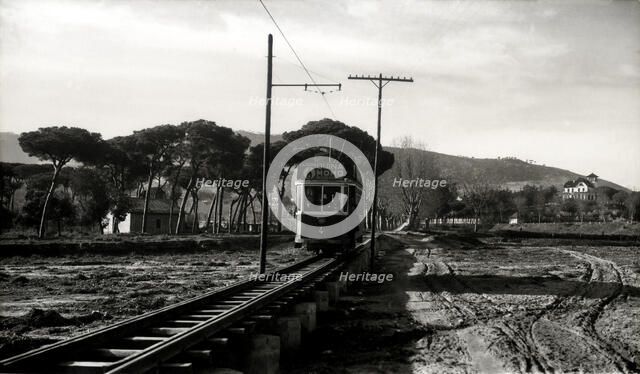 Argentona Mataró Tram crossing the pontoon on the river of Argentona, on a postcard of the 1920.
