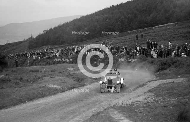 Ariel open 2-seater of AE Rollason competing in the Caerphilly Hillclimb, Wales, 1923. Artist: Bill Brunell.