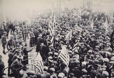 Armed troops confronting protesters during an industrial dispute, USA, 1912. Creator: Unknown