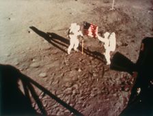 Armstrong and Aldrin unfurl the US flag on the moon, 1969. Creator: Unknown