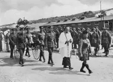 Army chaplain officiating at funeral of nurse killed in air raid on British base near Etables, 1918