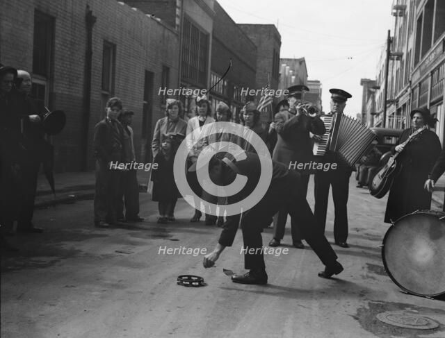 Army contributes first to the tambourine..., Salvation Army, San Francisco, California, 1939. Creator: Dorothea Lange.