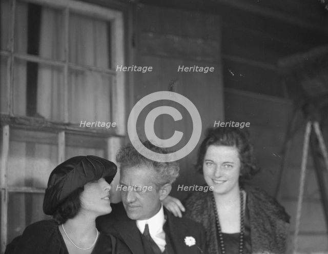 Arnold Genthe with two women friends on the porch of his bungalow in Long Beach, N.Y., c1911-c1942. Creator: Arnold Genthe.