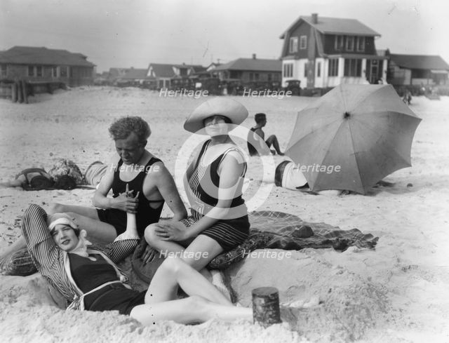 Arnold Genthe with two women friends in Long Beach, New York, between 1911 and 1942. Creator: Arnold Genthe.