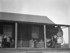 Arnold Genthe and two women friends seated on a swing on the porch of his...New York, c1911-c1942. Creator: Arnold Genthe