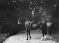 Arnold Genthe riding Chesty, between 1911 and 1936. Creator: Arnold Genthe