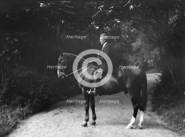 Arnold Genthe riding Chesty, between 1911 and 1936. Creator: Arnold Genthe.