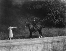 Arnold Genthe riding Chesty, between 1911 and 1936. Creator: Arnold Genthe