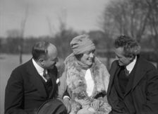 Arnold Genthe seated outdoors with two friends, between 1911 and 1942. Creator: Arnold Genthe