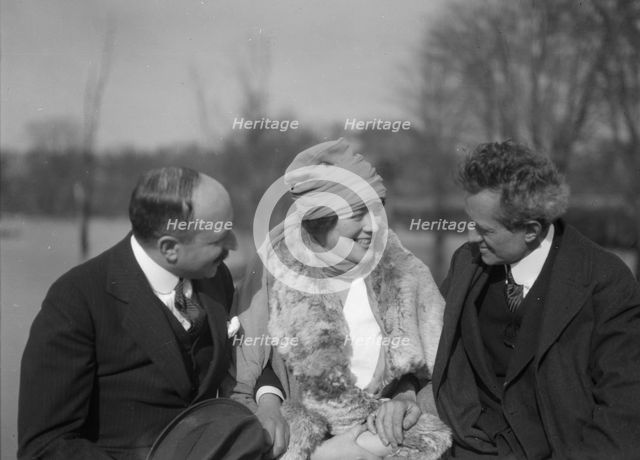 Arnold Genthe seated outdoors with two friends, between 1911 and 1942. Creator: Arnold Genthe.