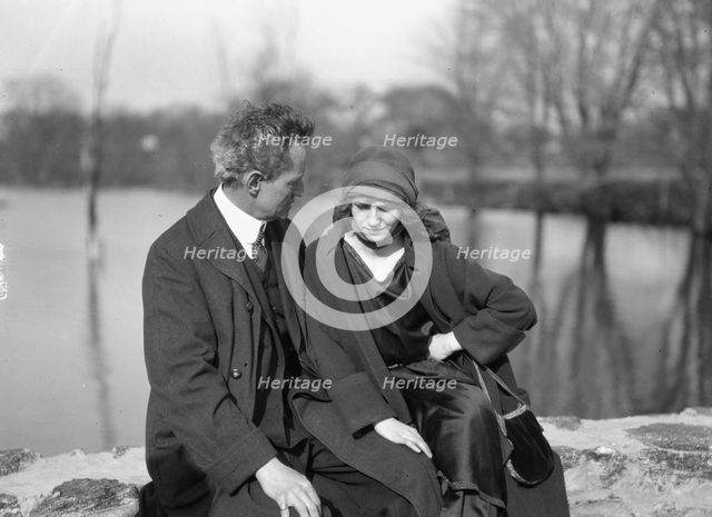 Arnold Genthe seated outdoors with a woman friend, between 1896 and 1942. Creator: Arnold Genthe.