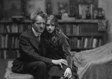 Arnold Genthe seated next to a woman friend in his studio in San Francisco, between 1896 and 1911. Creator: Arnold Genthe