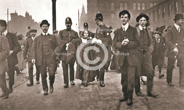 Arrest of Dora Marsden, British suffragette, outside the Victoria University of Manchester, 1909. Creator: Unknown.