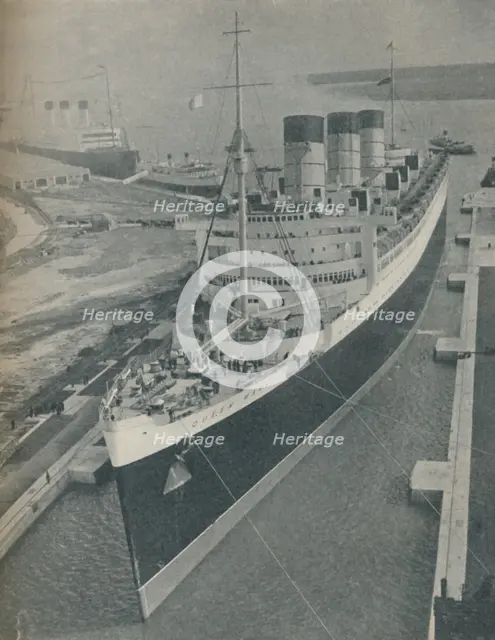 'Arrival of RMS Cunard White Star liner Queen Mary in King George V Graving Dock', 1936. Artist: Unknown.
