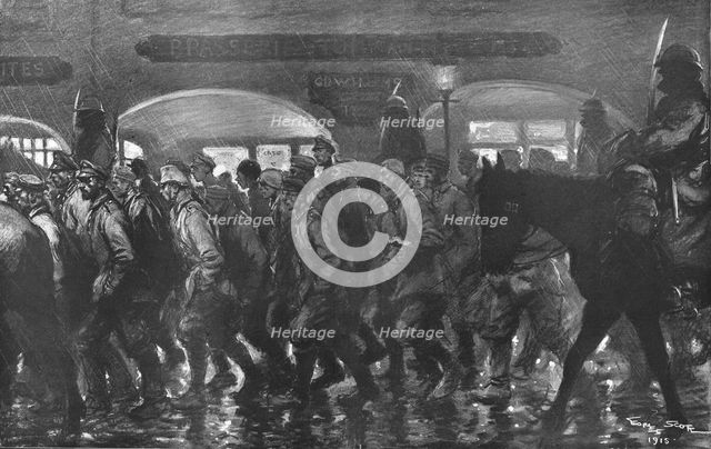 ''Arrivee a remiremont des prisonniers de l'Hartmannswillerkopf, le soir du 24 decembre 1915. Creator: Georges Bertin Scott.