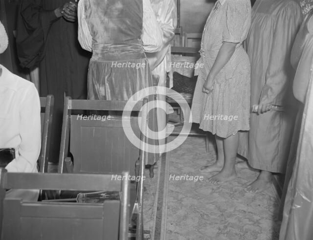 As in Moses' time, members of the St. Martin's Spiritual Church remove...Washington, D.C., 1942. Creator: Gordon Parks.