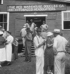 As the auctioneer knocks down the last bid on each basket of tobacco..., Douglas, Georgia, 1938. Creator: Dorothea Lange