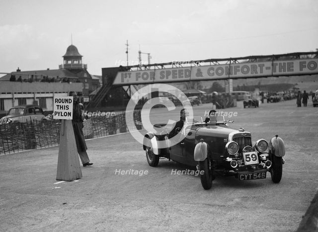 Aston Martin 4-seat open tourer competing in the JCC Rally, Brooklands, Surrey, 1939. Artist: Bill Brunell.