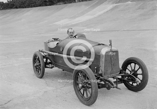 Aston Martin of GC Stead on the Members Banking at Brooklands, Surrey, c1920s. Artist: Bill Brunell.