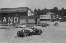 Aston Martin, Austin Ulster TT car and Austin 7, BARC meeting, Brooklands, Surrey, 1933. Artist: Bill Brunell