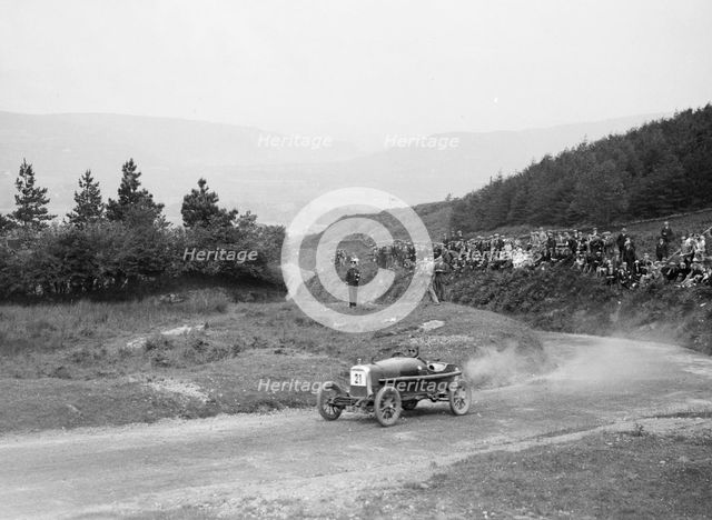 Aston Martin Bunny of Frank B Halford competing in the Caerphilly Hillclimb, Wales, 1923. Artist: Bill Brunell.