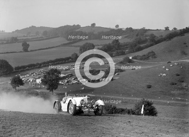 Aston Martin competing in the Singer CC Rushmere Hill Climb, Shropshire 1935. Artist: Bill Brunell.
