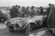 Aston Martin DB3S, Stirling Moss in paddock at Goodwood International Sports Car Race 1956. Creator: Unknown