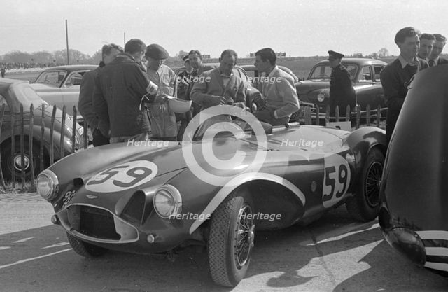 Aston Martin DB3S, Stirling Moss in paddock at Goodwood International Sports Car Race 1956. Creator: Unknown.