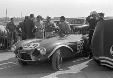 Aston Martin DB3S, Stirling Moss in paddock at Goodwood International Sports Car Race 1956. Creator: Unknown