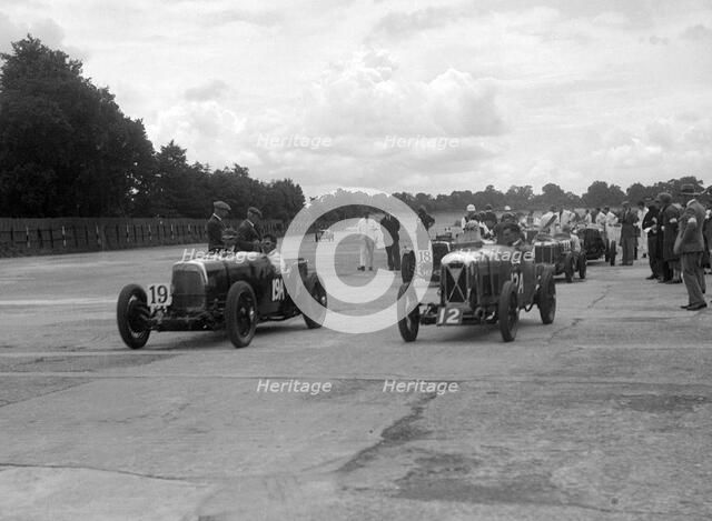 Aston Martins, Salmson and MG at the start of the LCC Relay GP, Brooklands, 25 July 1931. Artist: Bill Brunell.