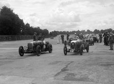 Aston Martins, Salmson and MG at the start of the LCC Relay GP, Brooklands, 25 July 1931. Artist: Bill Brunell