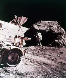 Astronaut with Lunar Roving Vehicle on the Moon, 1970s. Creator: NASA