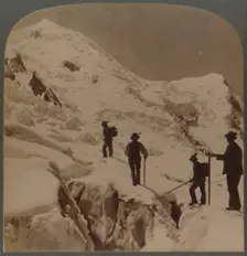 Ascent of Mt. Blanc - crossing Bossons Glacier - Grands Mulets in distance, Alps 1901. Creator: Underwood & Underwood