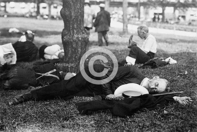 Asleep in Battery Park on hot day, between c1910 and c1915. Creator: Bain News Service.