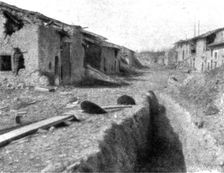 Aspects du champ de bataille de Verdun; route traversant le village dispute de Cumieres..., 1916. Creator: Unknown