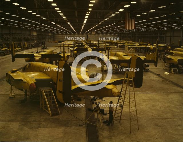 Assembling B-25 bombers at North American Aviation, Kansas City, Kansas, 1942. Creator: Alfred T Palmer.