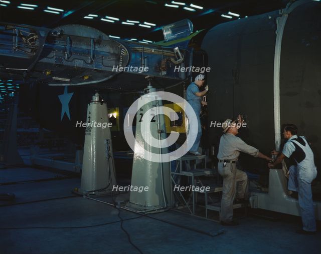 Assembling Liberator Bomber, Consolidated Aircraft Corp., Fort Worth, Texas, 1942. Creator: Howard Hollem.