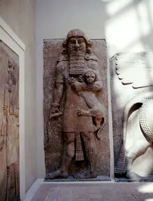 Assyrian sculpture of Gilgamesh holding a lion, Khorsabad, c8th century BC