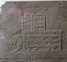 Assyrian relief of a lion being released from a cage for a hunt, 7th century