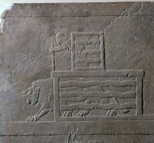Assyrian relief of a lion being released from a cage for a hunt, 7th century