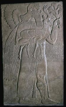 Assyrian relief of a winged figure, 9th century BC