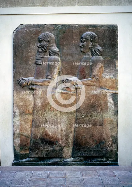 Assyrian relief of two servants, Palace of Sargon II, Khorsabad, c8th century BC. Artist: Unknown