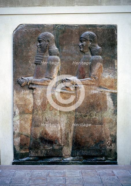 Assyrian relief of two servants, Palace of Sargon II, Khorsabad, c8th century BC. Artist: Unknown
